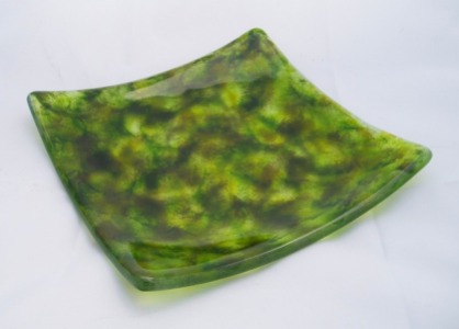 An example of color layering using the frit manipulation technique, using multiple shades of green. Plate is 7"x7".