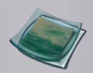 Green and ivory streaky, framed with blue-green tinted glass.