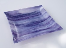 Violet and white streaky, single layer, slumped and formed. A good example of slumping glass that is not normally considered fusible.